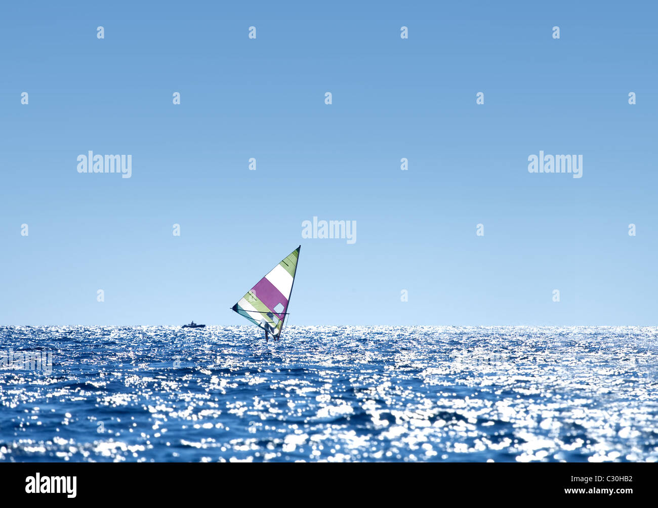 Windsurfer sailing on open sea Stock Photo