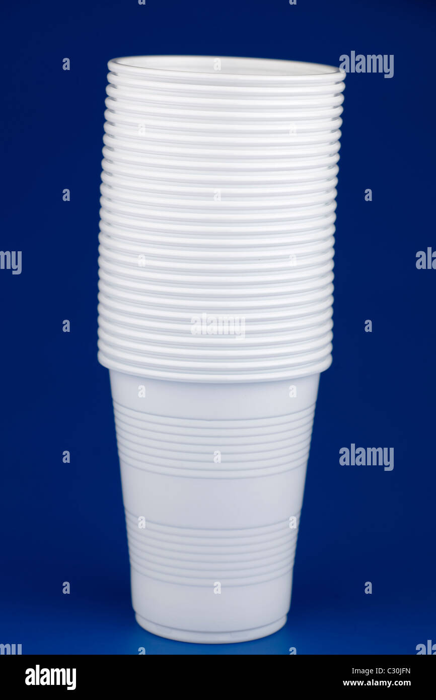 Twenty five white plastic disposable drinking cups Stock Photo