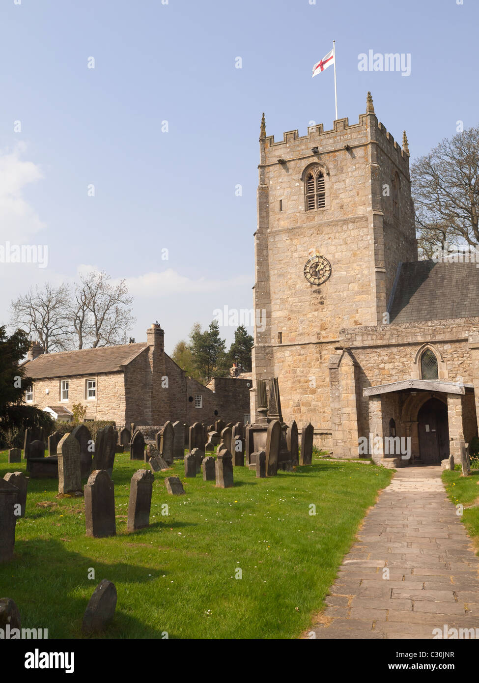 Cottages and the historic church of St Romald in the conservation area village of Romaldkirk Teesdale Co Durham Stock Photo