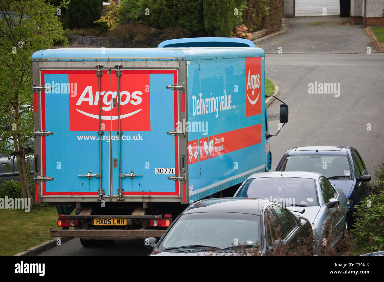 UK, Europe. Argos home delivery van in a narrow suburban street Stock