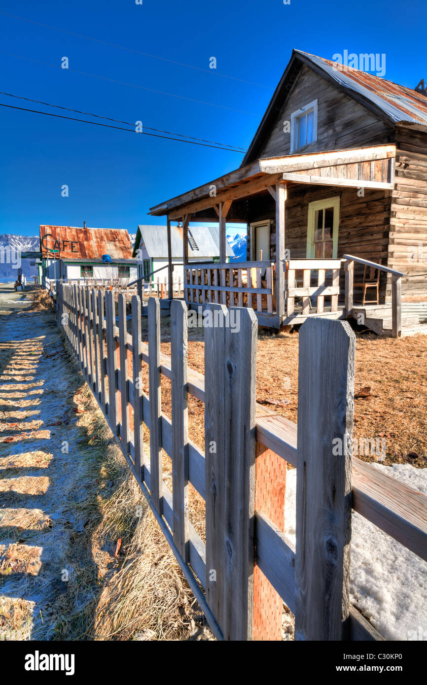 Old cabin with picket fence in Downtown Hope along Turnagain Arm, Kenai Peninsula, Southcentral Alaska, Spring, HDR Stock Photo