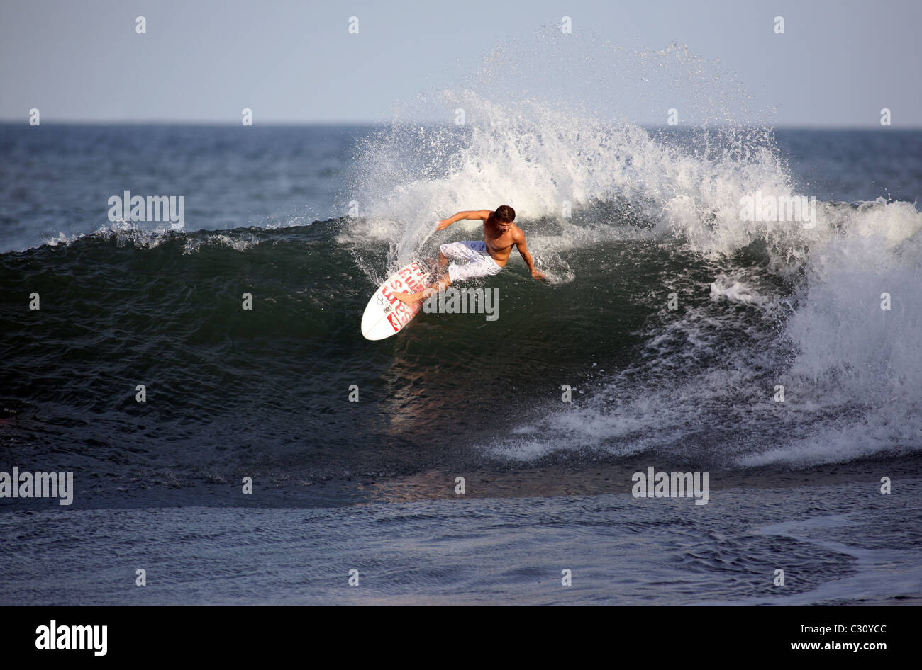 American professional surfer Dane Reynolds surfing a wave in El Salvador. Stock Photo