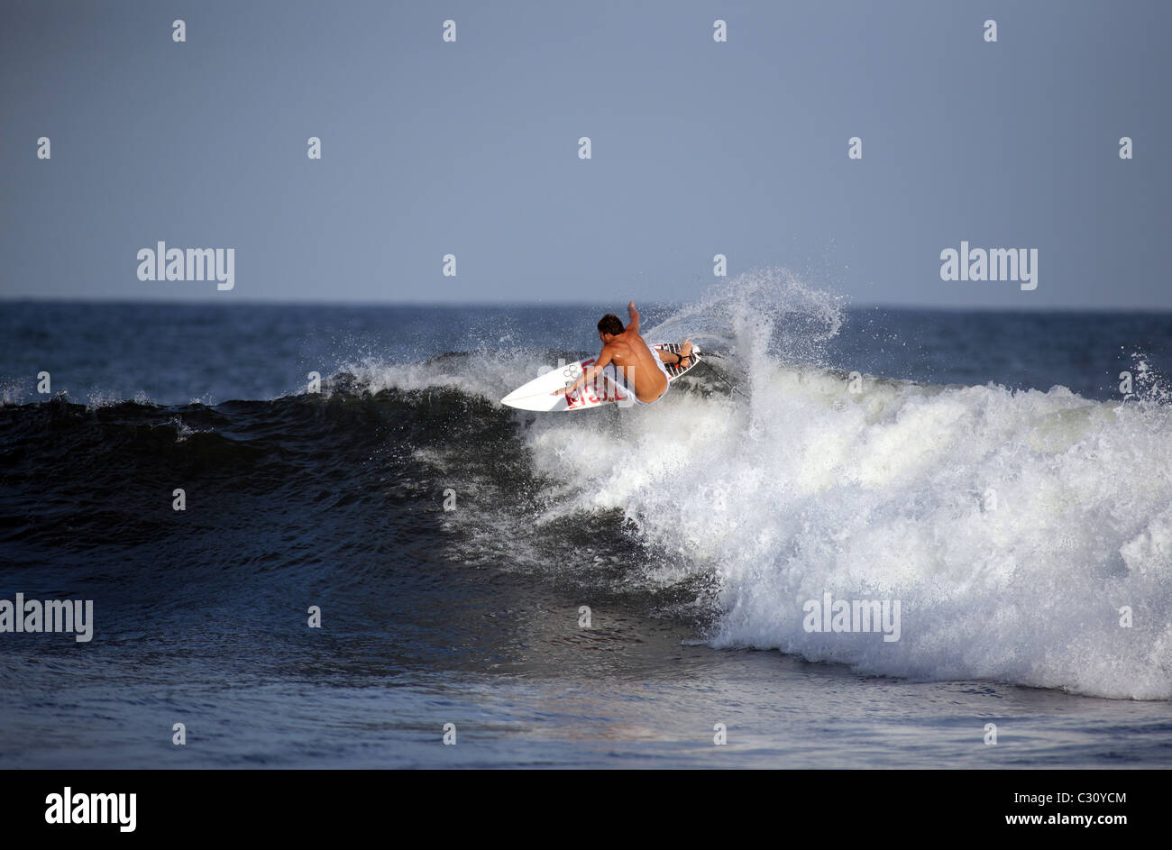 American professional surfer Dane Reynolds surfing a wave in El Salvador. Stock Photo