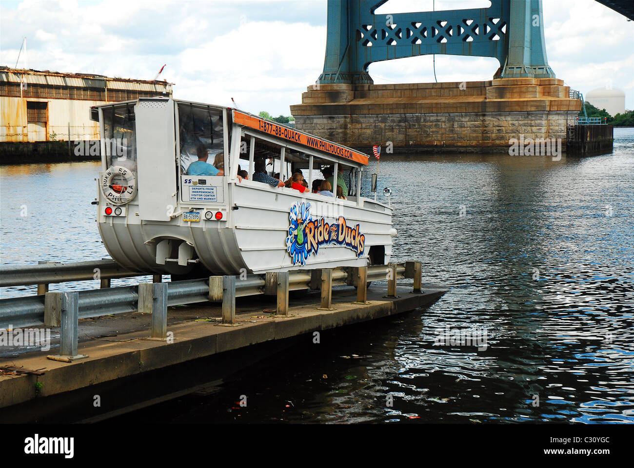 A Duck Mobile enters the Delaware River near the Ben Franklin Bridge in Philadelphia Stock Photo