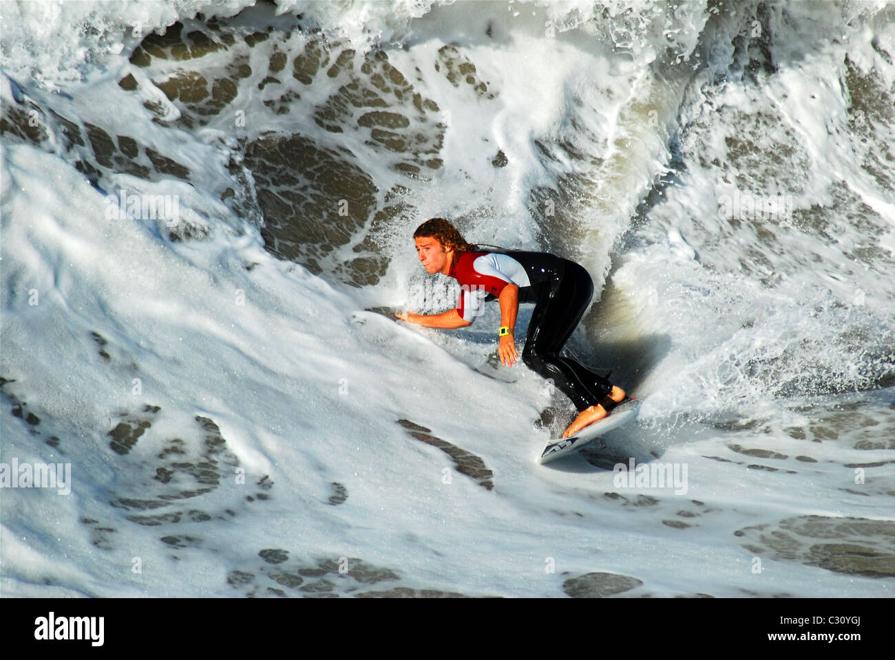 Iconic California image, surfer catching a wave. Stock Photo