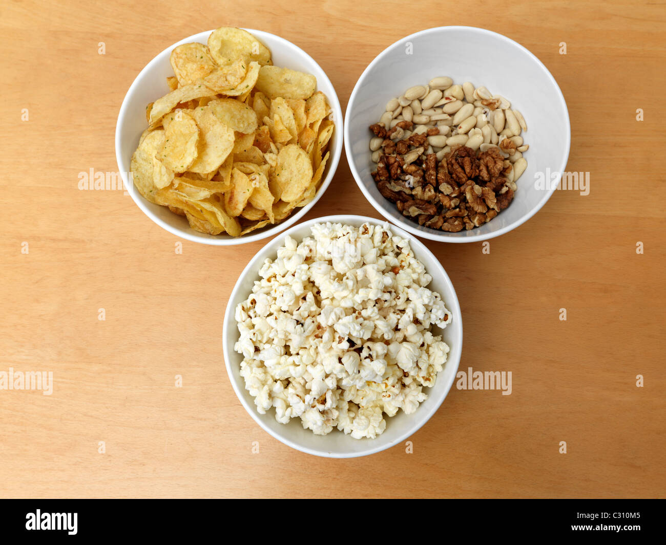 Bowls Of Crisps, Nuts And Popcorn Stock Photo Alamy