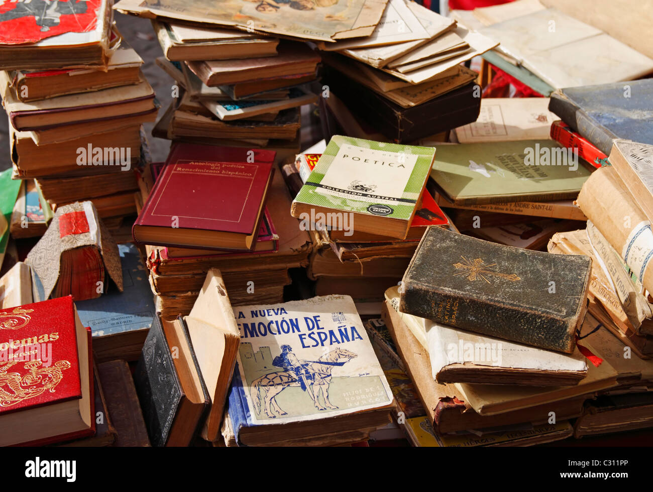 Secondhand books on stall in famous street market in calle Ferria, in barrio Macarena, Seville, Spain, Europe Stock Photo