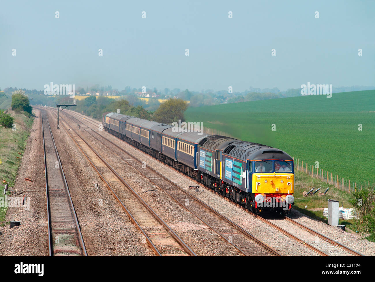 A pair of class 47 diesel locomotives numbers 47810 and 47501 working a Cruise Saver Express charter near Cholsey on 19th April 2011. Stock Photo