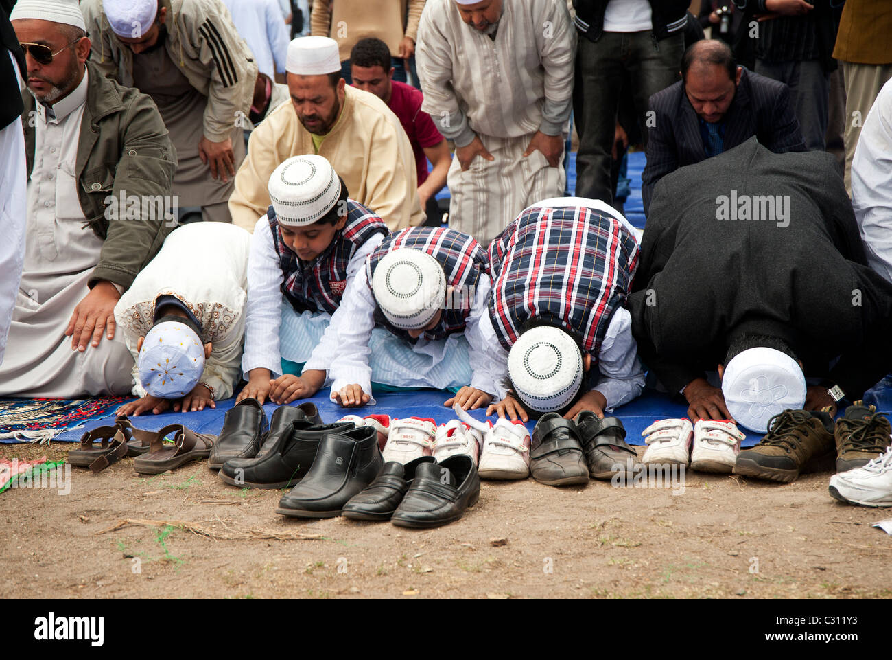 Rome, Italy -  April 22, 2011 - Muslim people gathered for praying Stock Photo