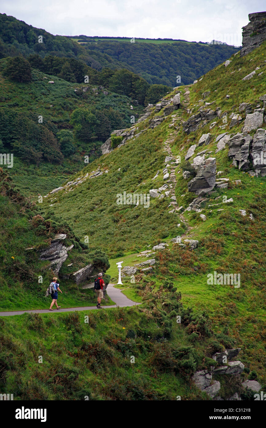 Two walkers on the South West Coast Path near the Valley of Rocks in North Devon  England UK Stock Photo