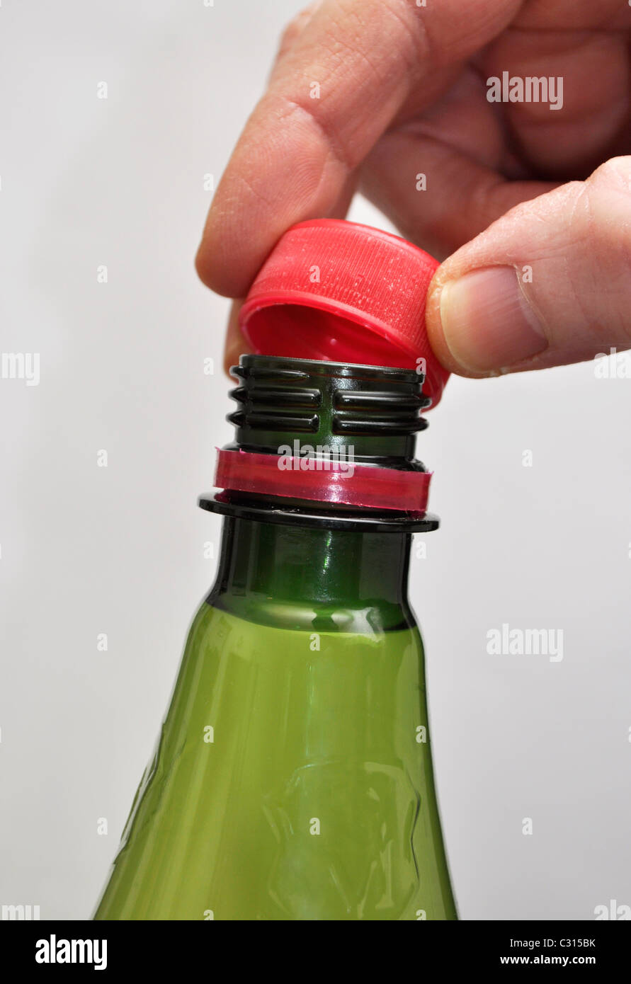 hand opening plastic bottle Stock Photo Alamy