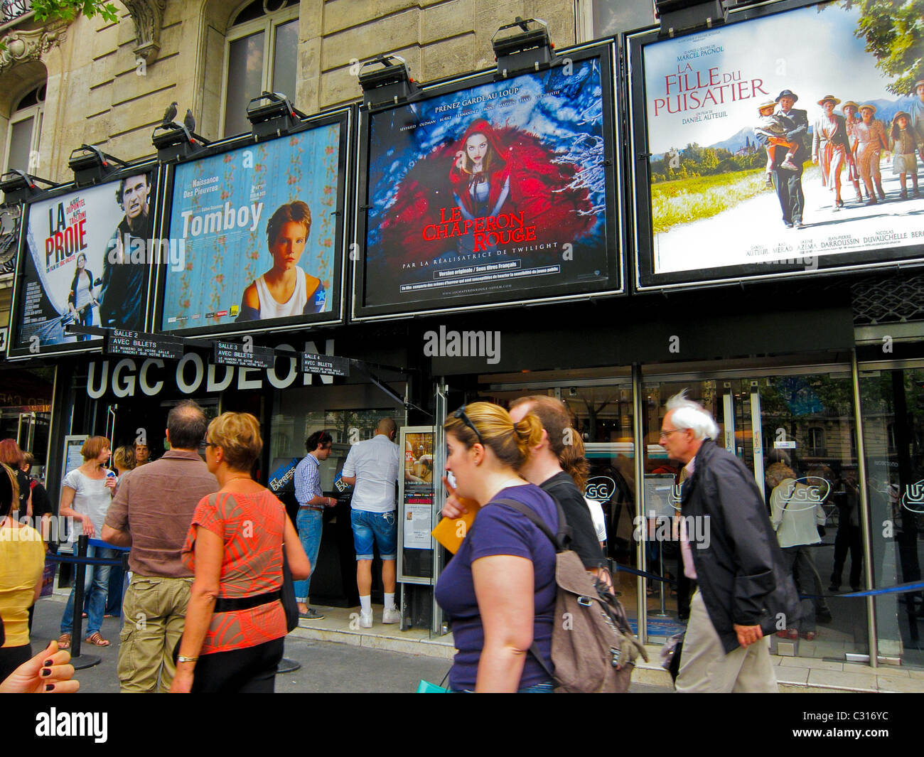 Paris, France, People Walking in Front of French Cinema Theatre Marquee, in Saint Germain des pres District, UGC Odeon cinema posters, paris busy street Paris in the daytime Stock Photo
