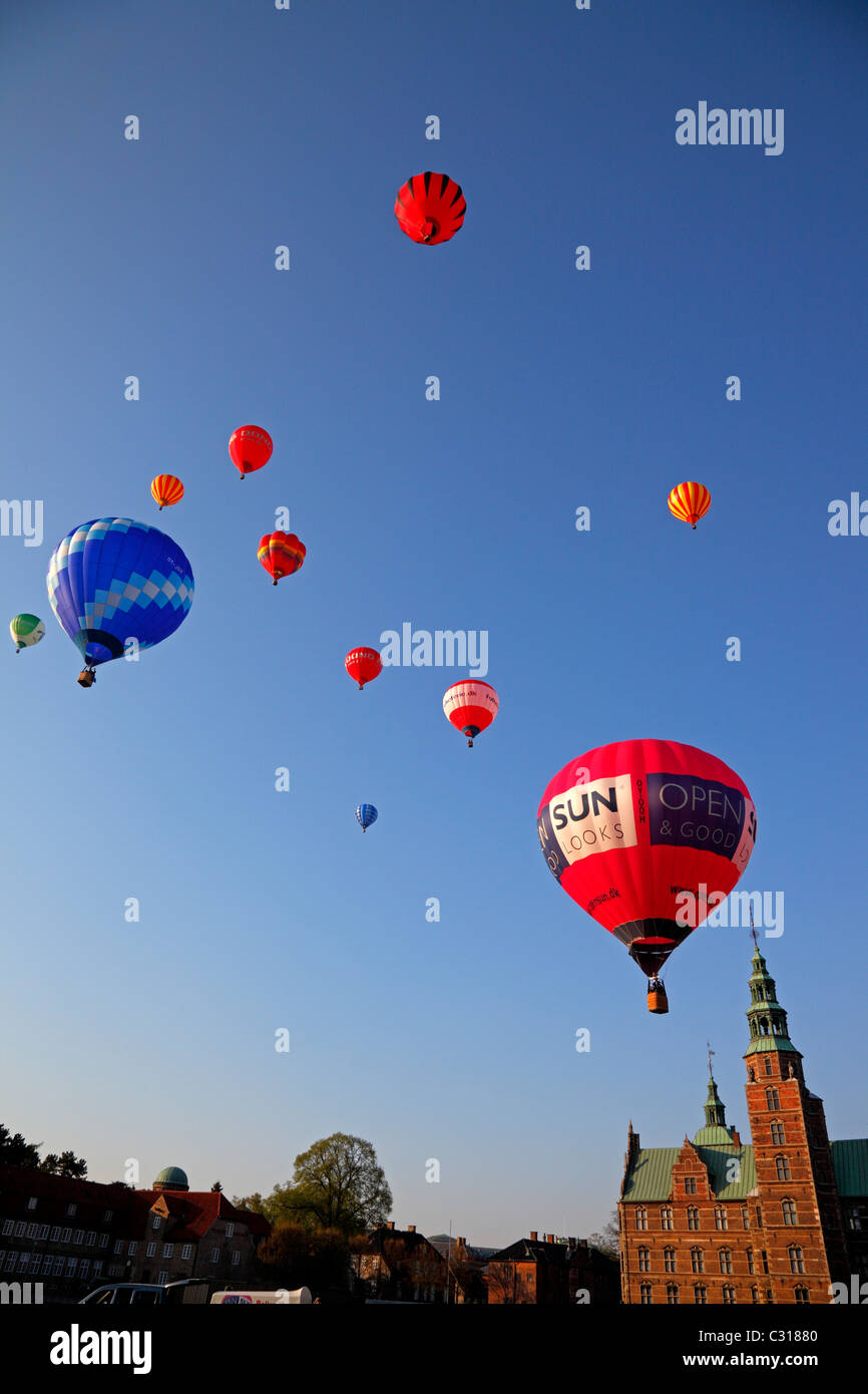 12 enormous hot air balloons in a commemorative ascension on the 200th anniversary of the first Danish hot air balloon voyage. The King's Garden, Copenhagen, Denmark. Rosenborg Castle. Stock Photo