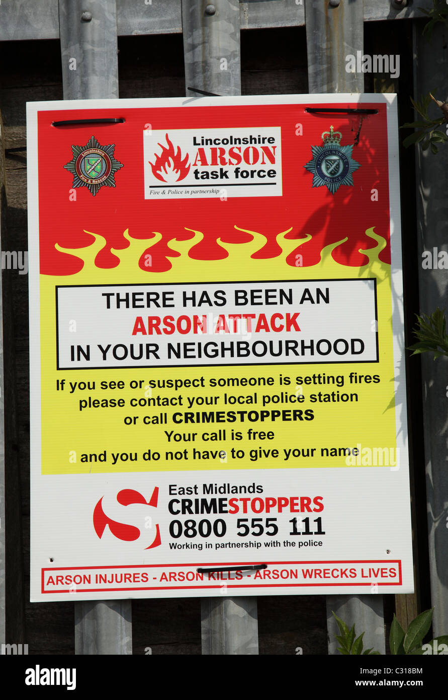 An arson attack warning sign in the U.K. neighbourhood. Stock Photo