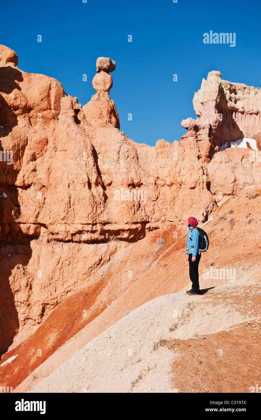 Female hiker enjoys view from Queens Garden trail, Bryce Canyon national park, Utah, USA Stock Photo