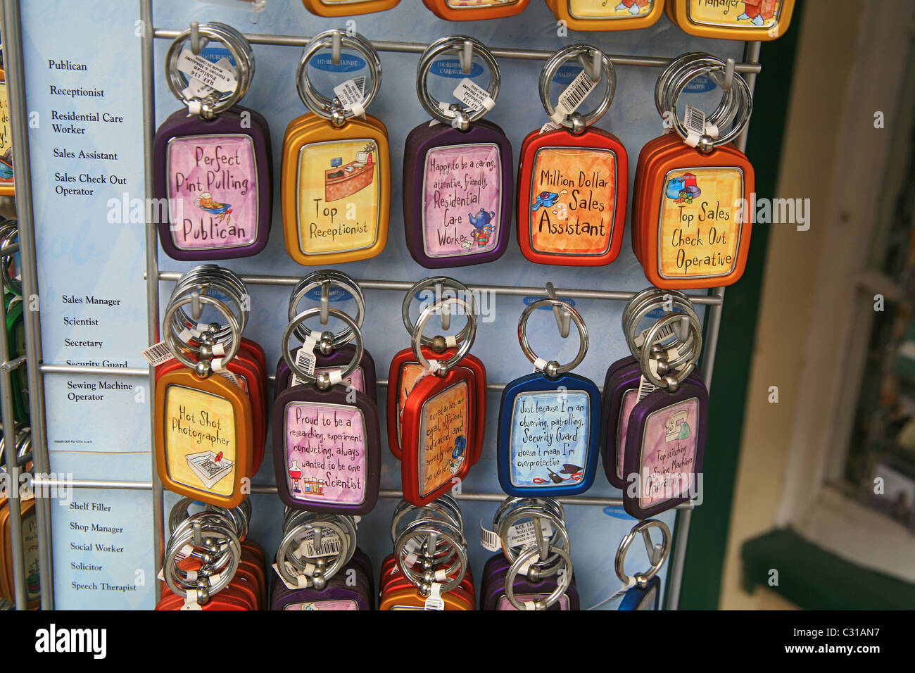 A occupational keyring carousel outside a souvenir shop in Lynmouth Devon England UK Stock Photo