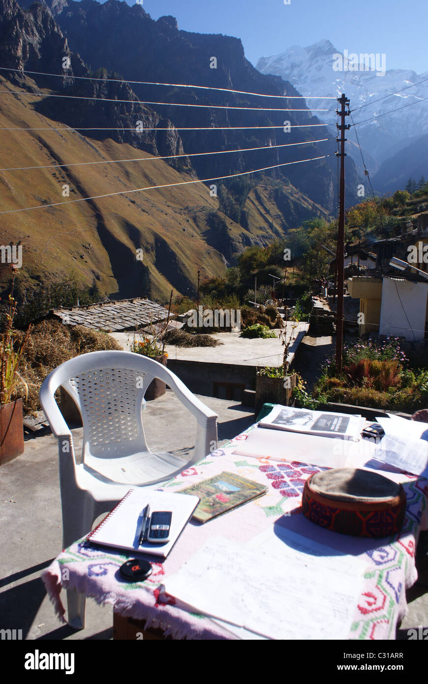 Garhwal Himalayas, India: The picturesque Bhotia village of Tolma, with Dunagiri looming in the distance. Stock Photo