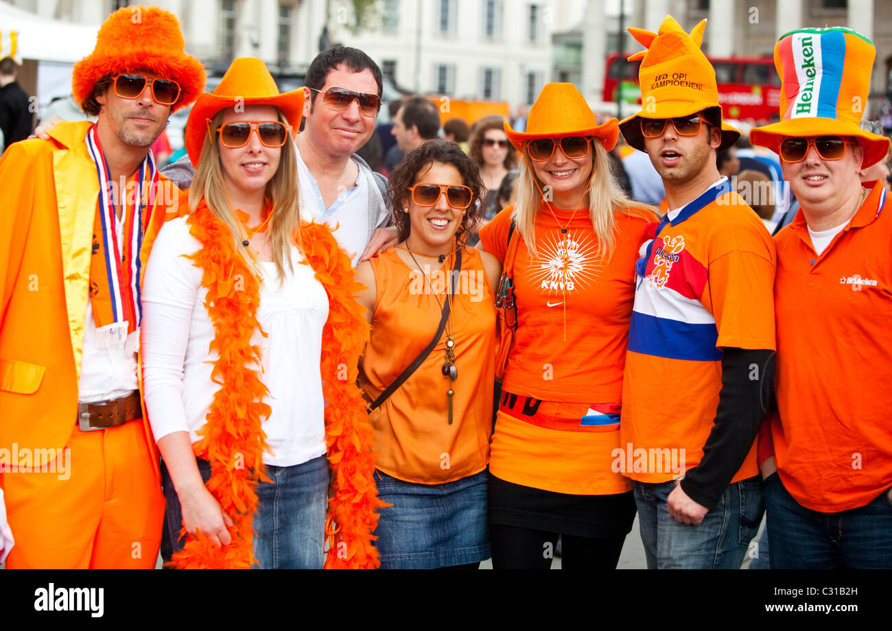 Holland House- Group of Dutch people celebrating The Dutch Queen's Day in Trafalgar Square, London, England, UK. Stock Photo