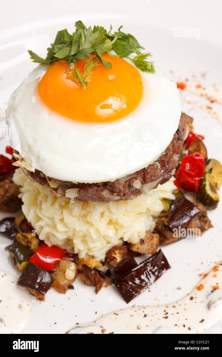 beef burger with egg and potatoes Stock Photo Alamy
