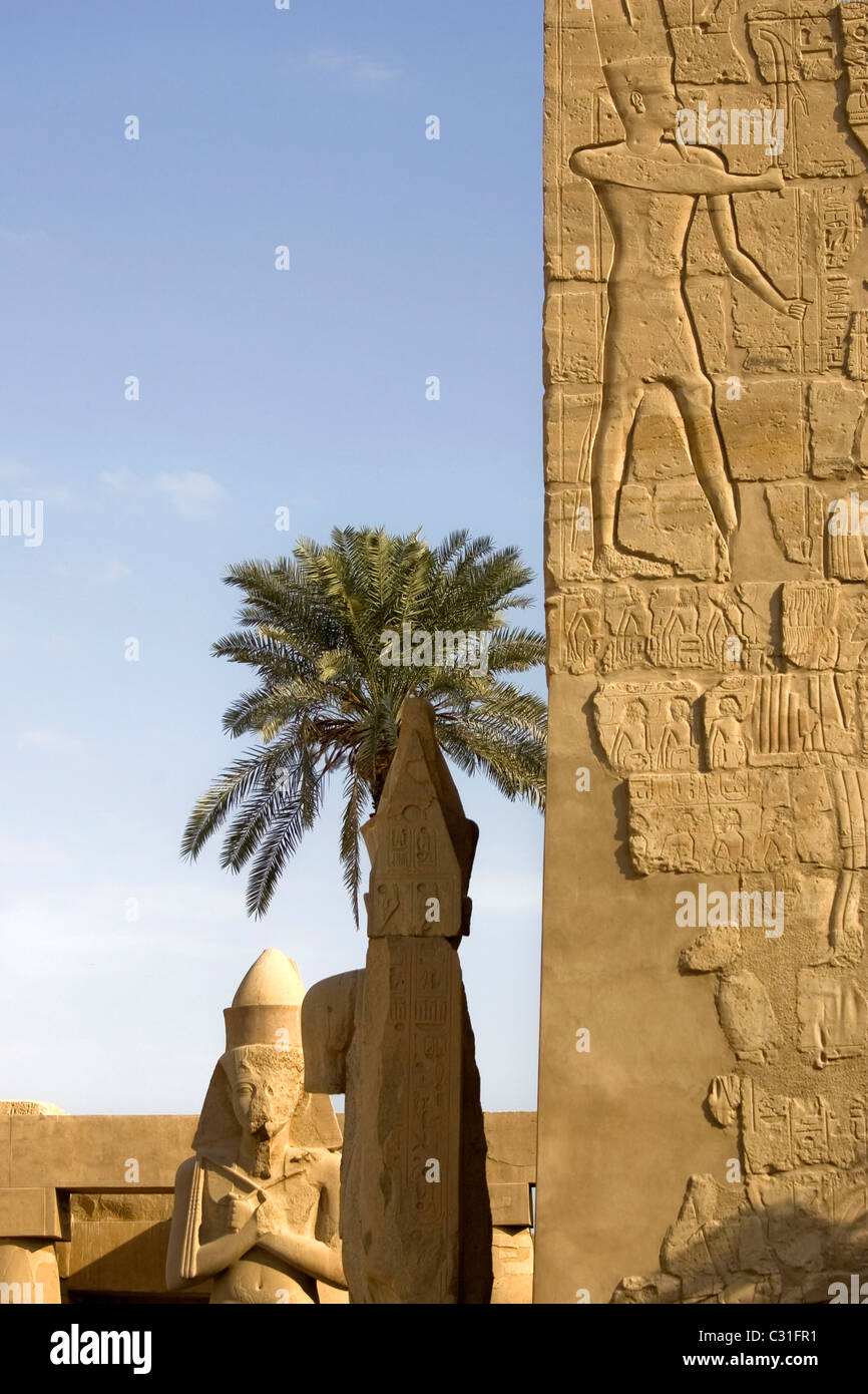 COLOSSAL STATUE OF RAMSES II SITUATED IN THE GREAT COURTYARD OF THE TEMPLE OF KARNAK, IPET SOUT Stock Photo