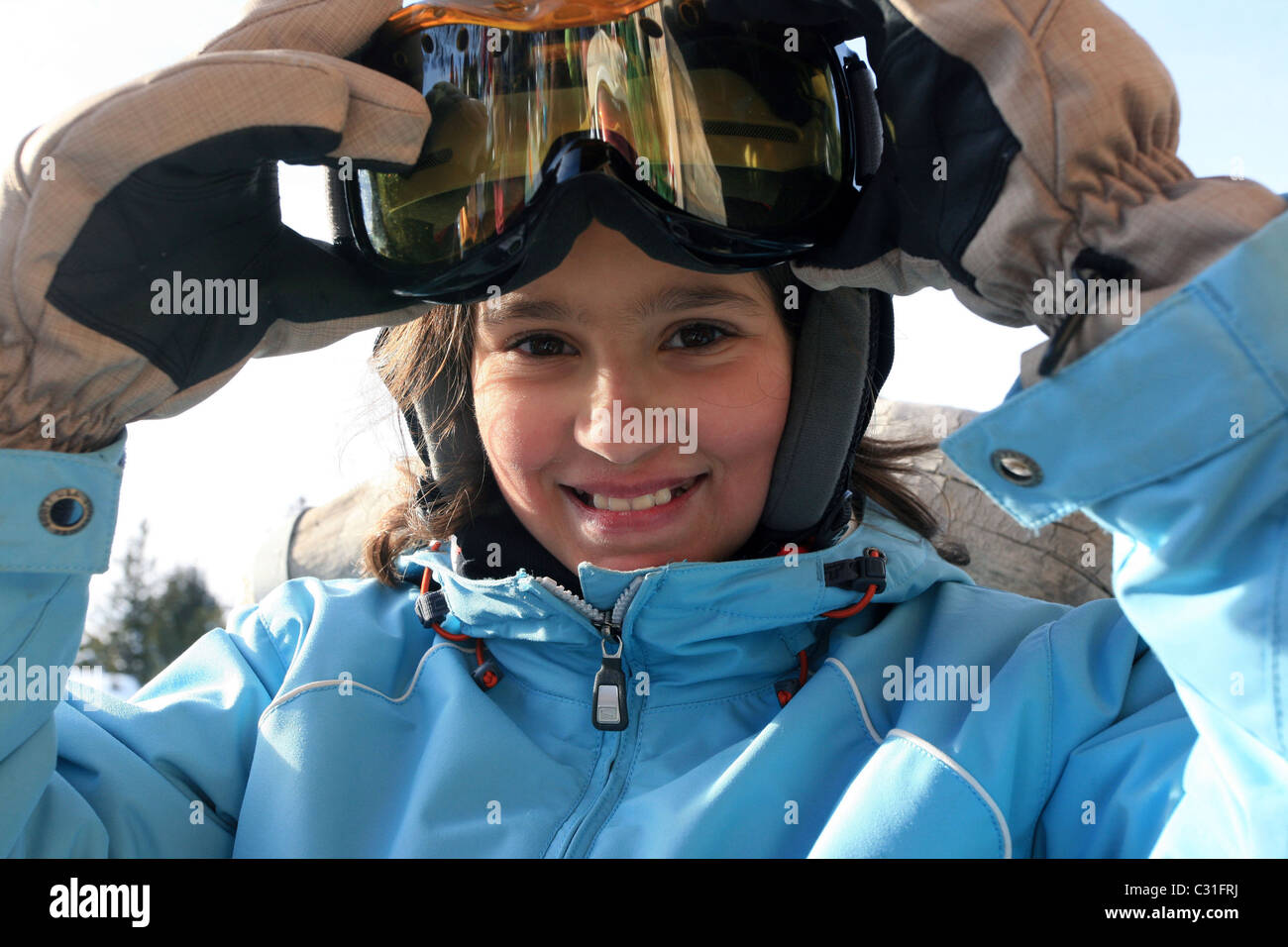 YOUNG GIRL WITH SKI MASK AND HAT Stock Photo