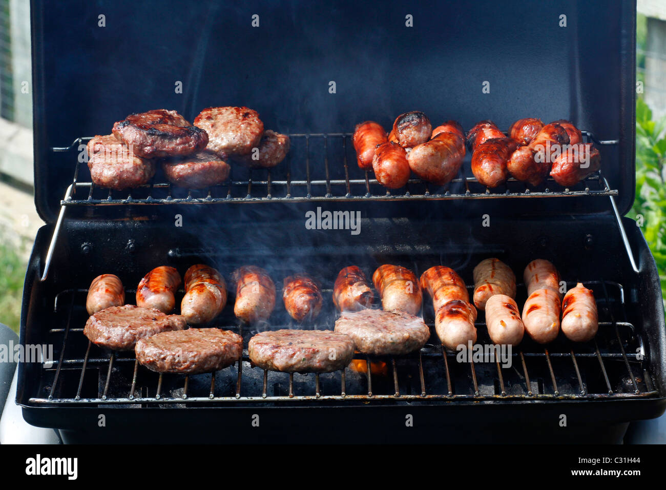 Sausages burgers cook on barbecue hires stock photography and images
