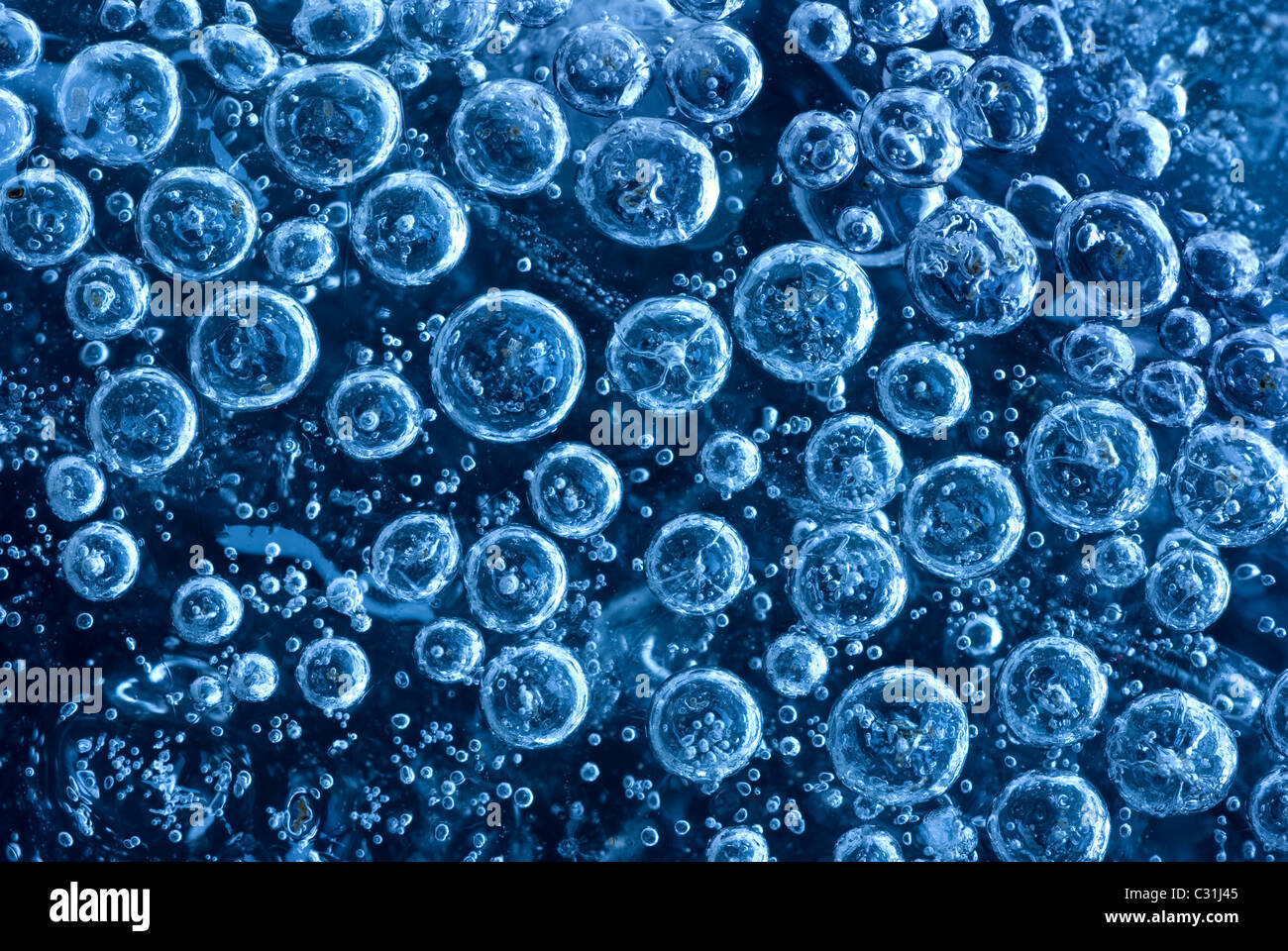 Bubbles trapped in ice, close-up Stock Photo