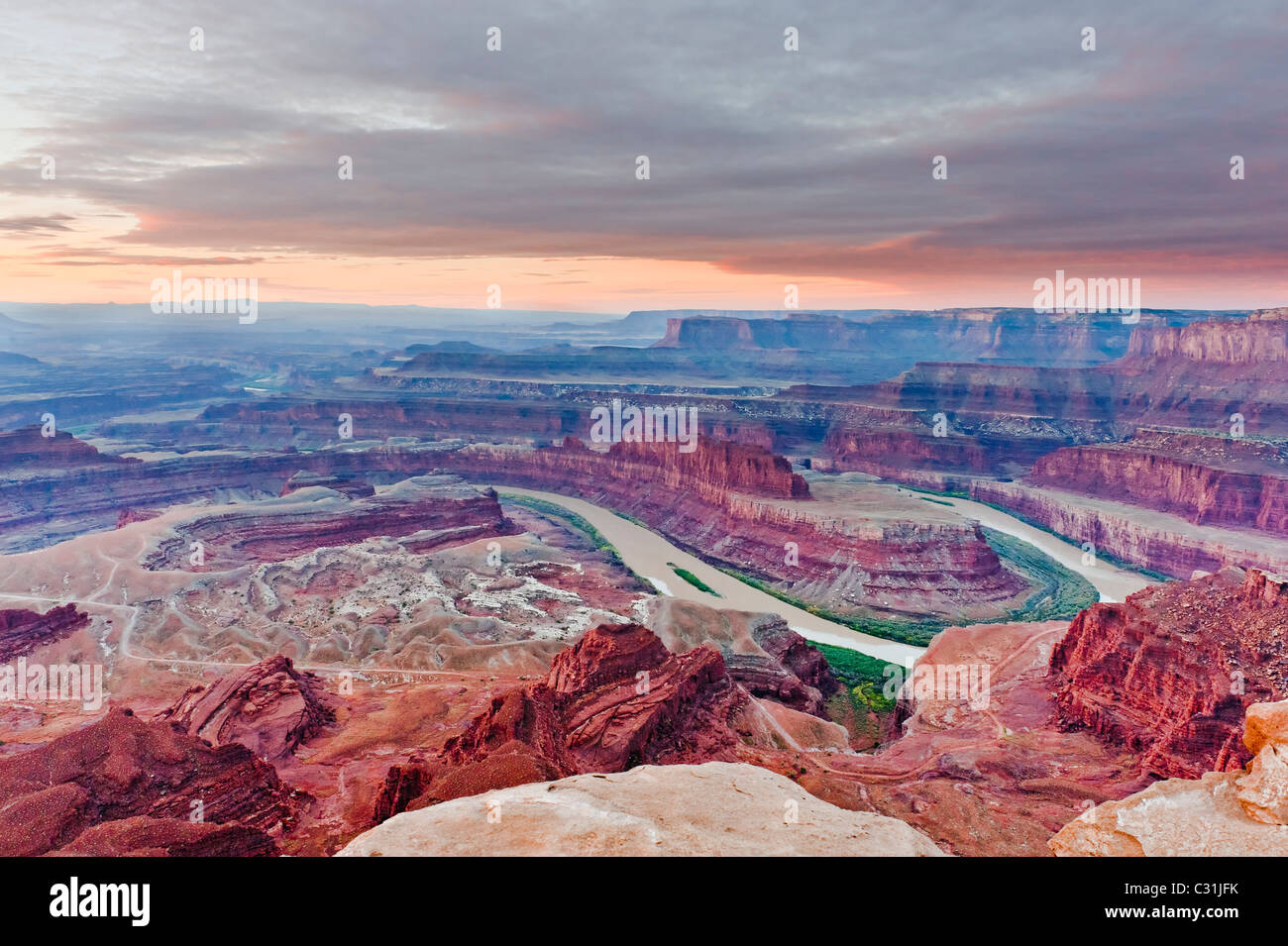 Red sky in the morning.  Sunrise at Dead Horse Point in the Dead Horse State Park  & Canyonlands near Moab Utah USA. Stock Photo