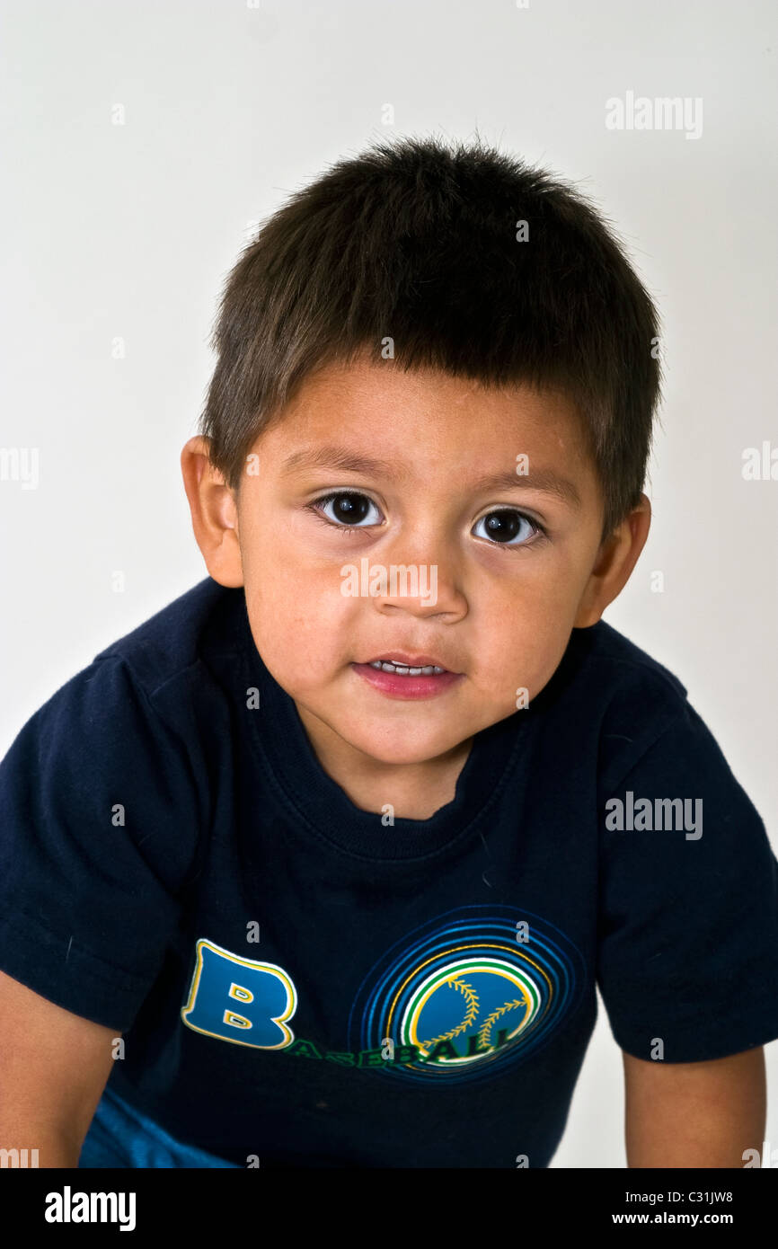 Looking straight at camera 4-5 year old Hispanic boy portrait eye contact MR © Myrleen Pearson Stock Photo