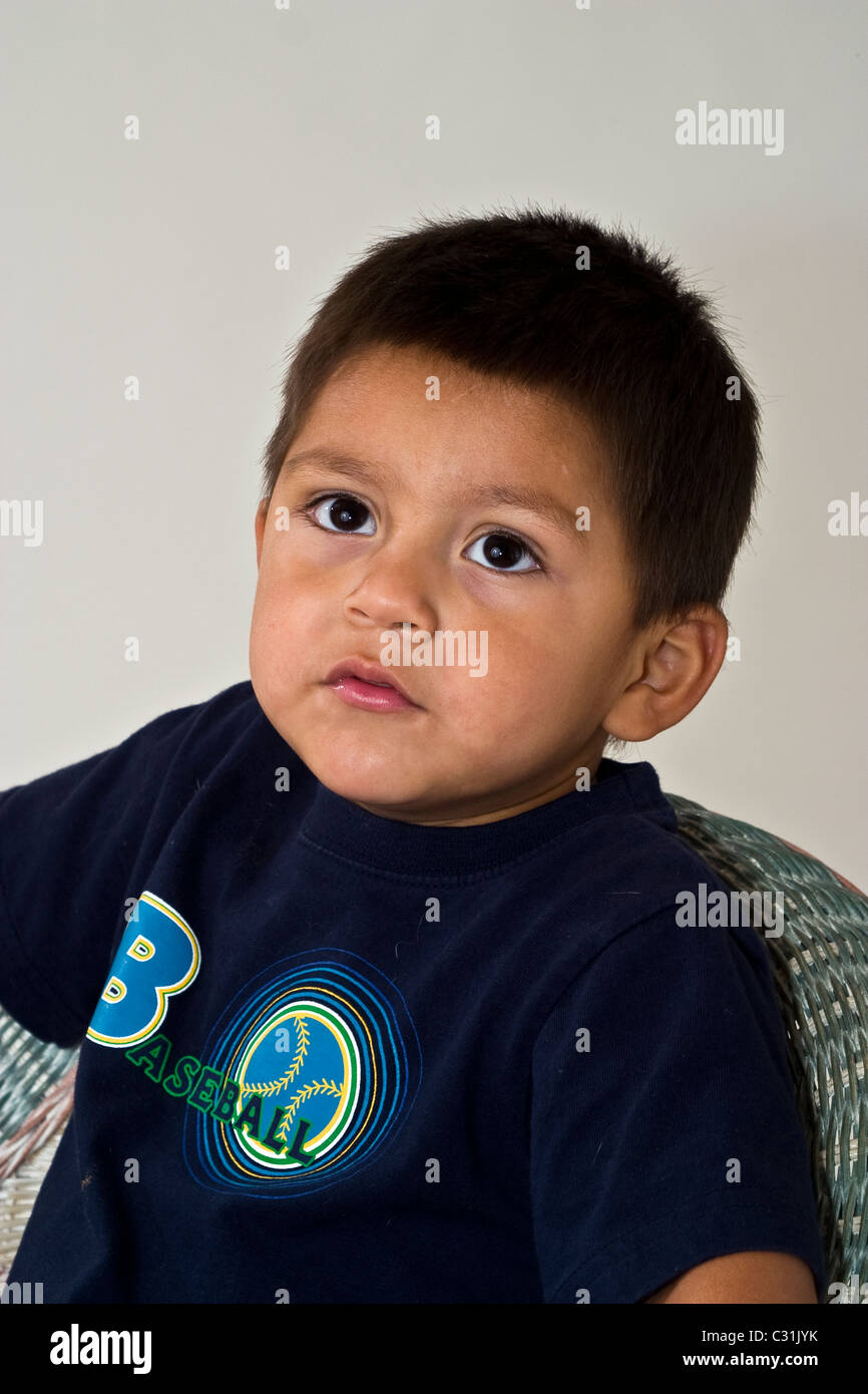 4-5 year old serious  multi diverse young Hispanic boy looking up high view  portrait MR © Myrleen Pearson Stock Photo