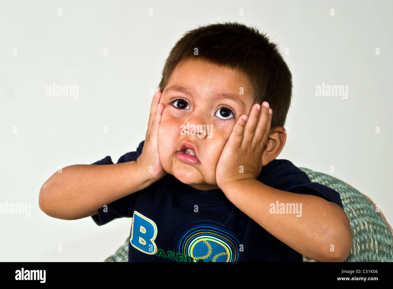 4-5 year old Hispanic boy portrait eye contact oh my gosh MR © Myrleen Pearson Stock Photo