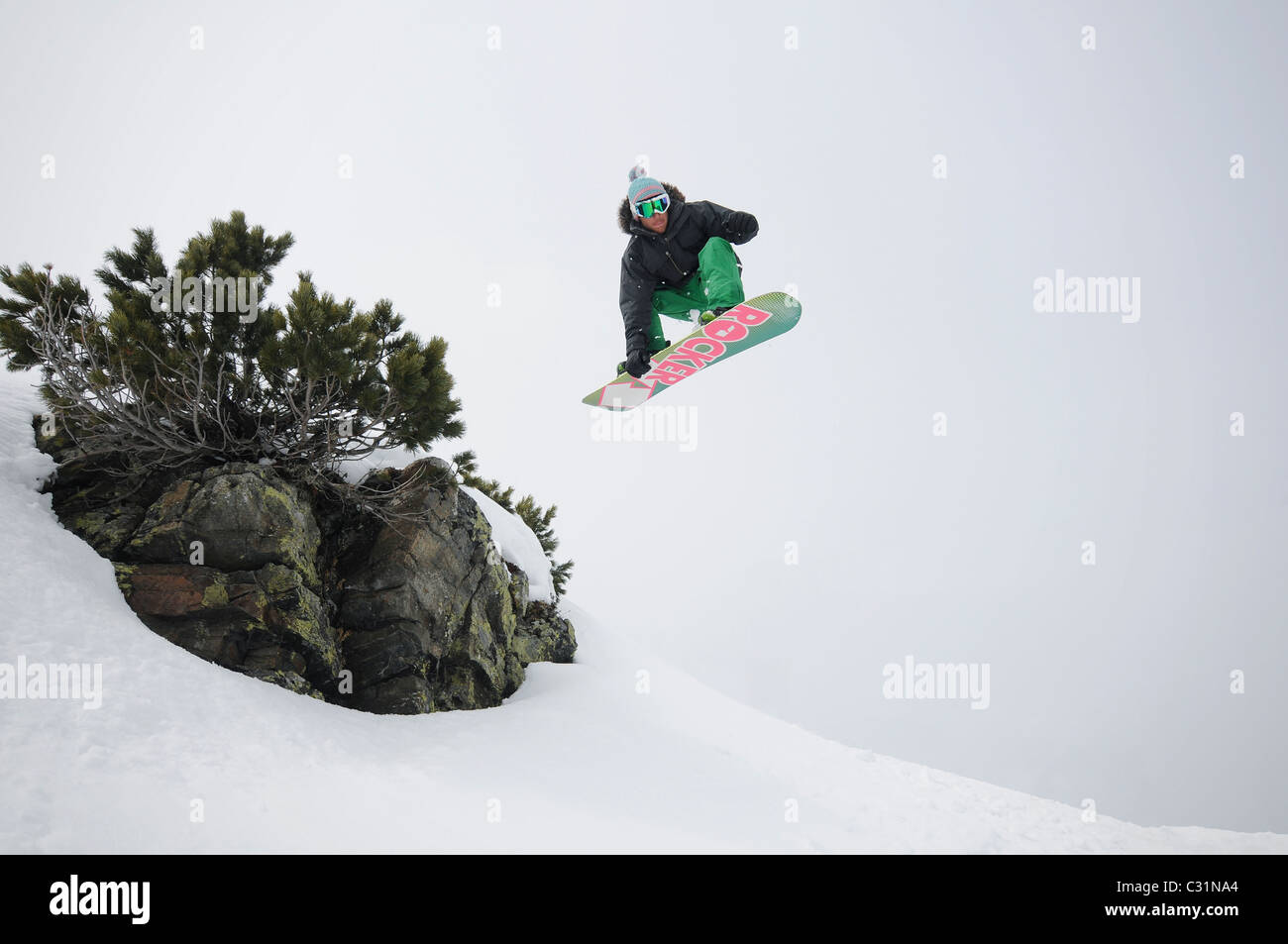 Snowboard Grab Off Large Rock Stock Photo Alamy Snowboard Grab Off Large Rock Stock Photo Alamy
