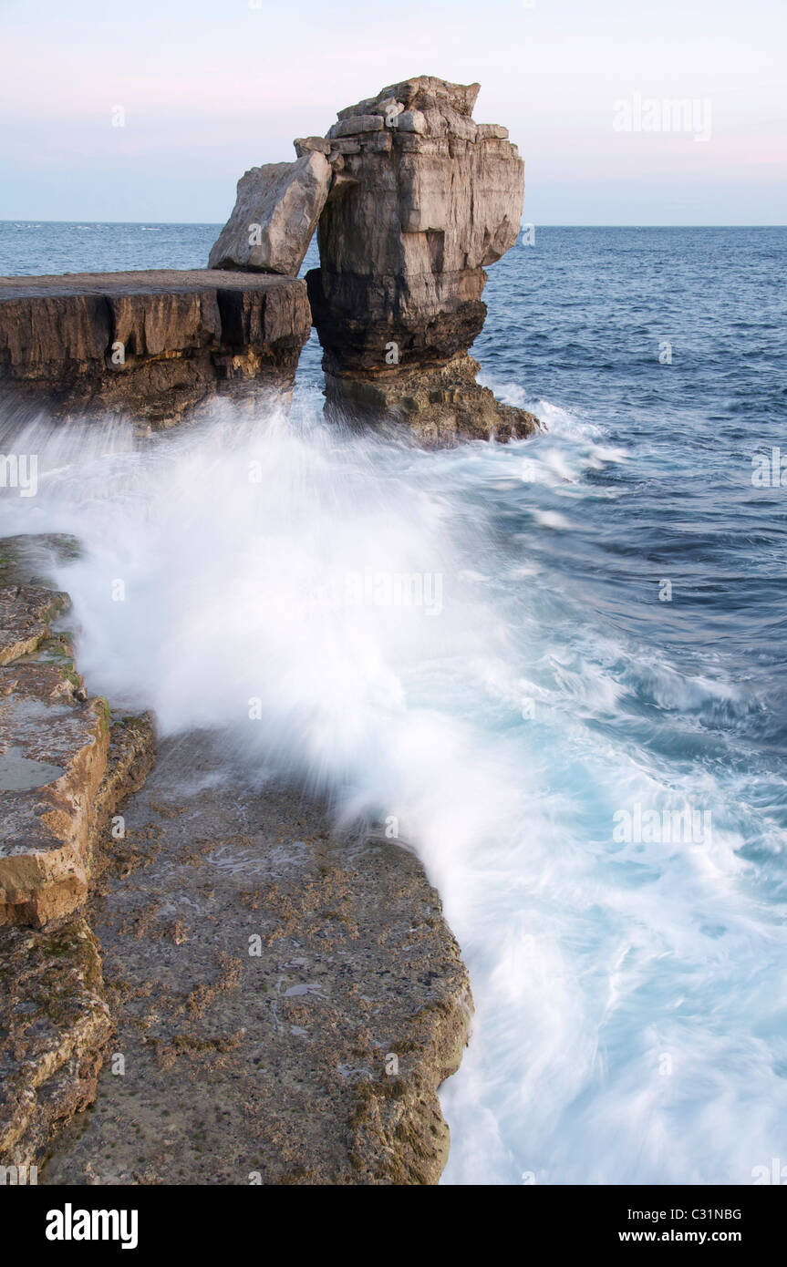 Pulpit Rock in a stormy sea. This massive limestone stack stands just off Portland Bill on the Isle of Portland. Jurassic Coast, Dorset, England, UK. Stock Photo