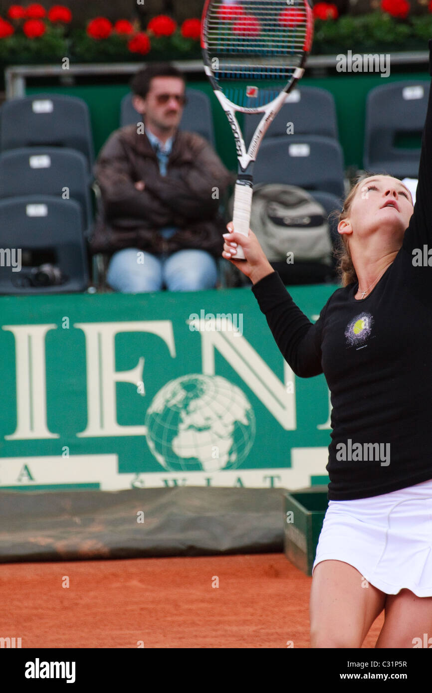 Agnieszka Radwańska serving in a match vs Elena Dementieva Stock Photo