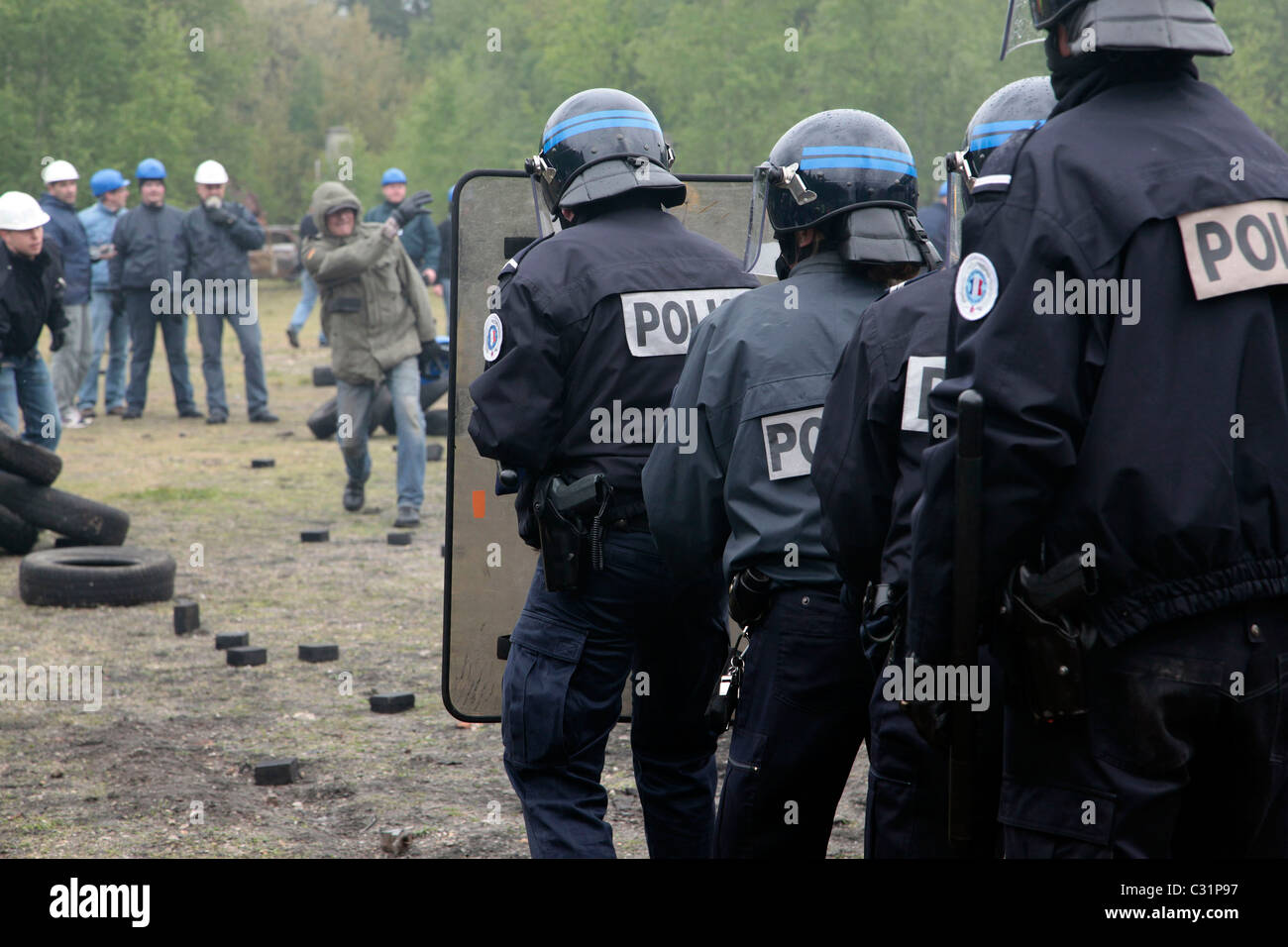 Police with shields moving towards the demonstrators hi-res stock ...