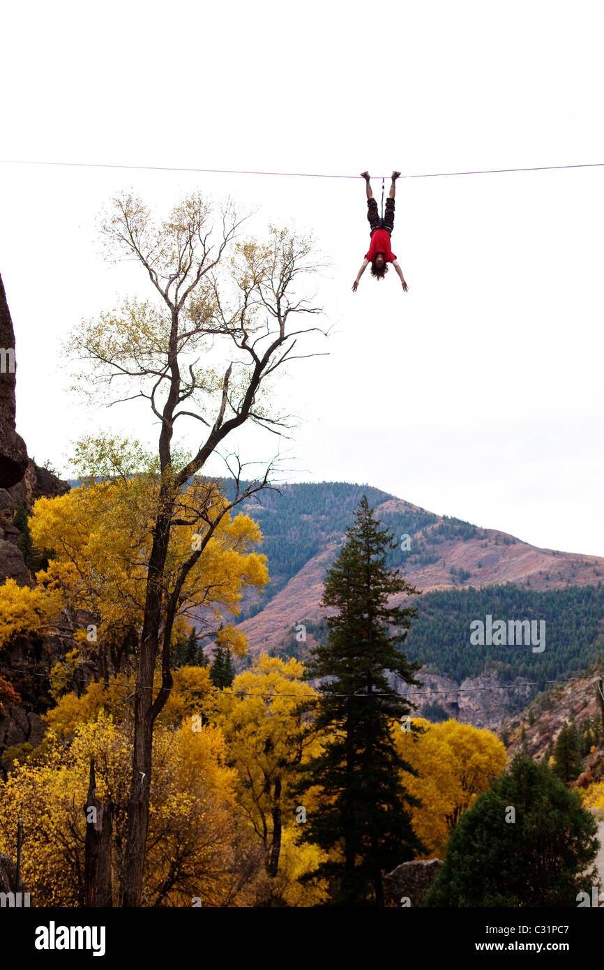 Man hanging upside down from hi-res stock photography and images - Alamy
