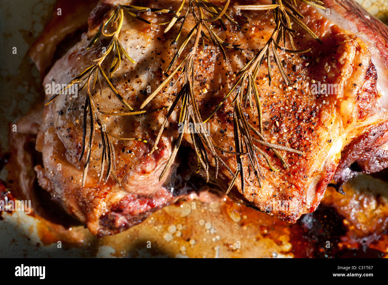 Fresh roasted lamb shoulder joint prepared with rosemary and herbs direct from the oven Stock Photo