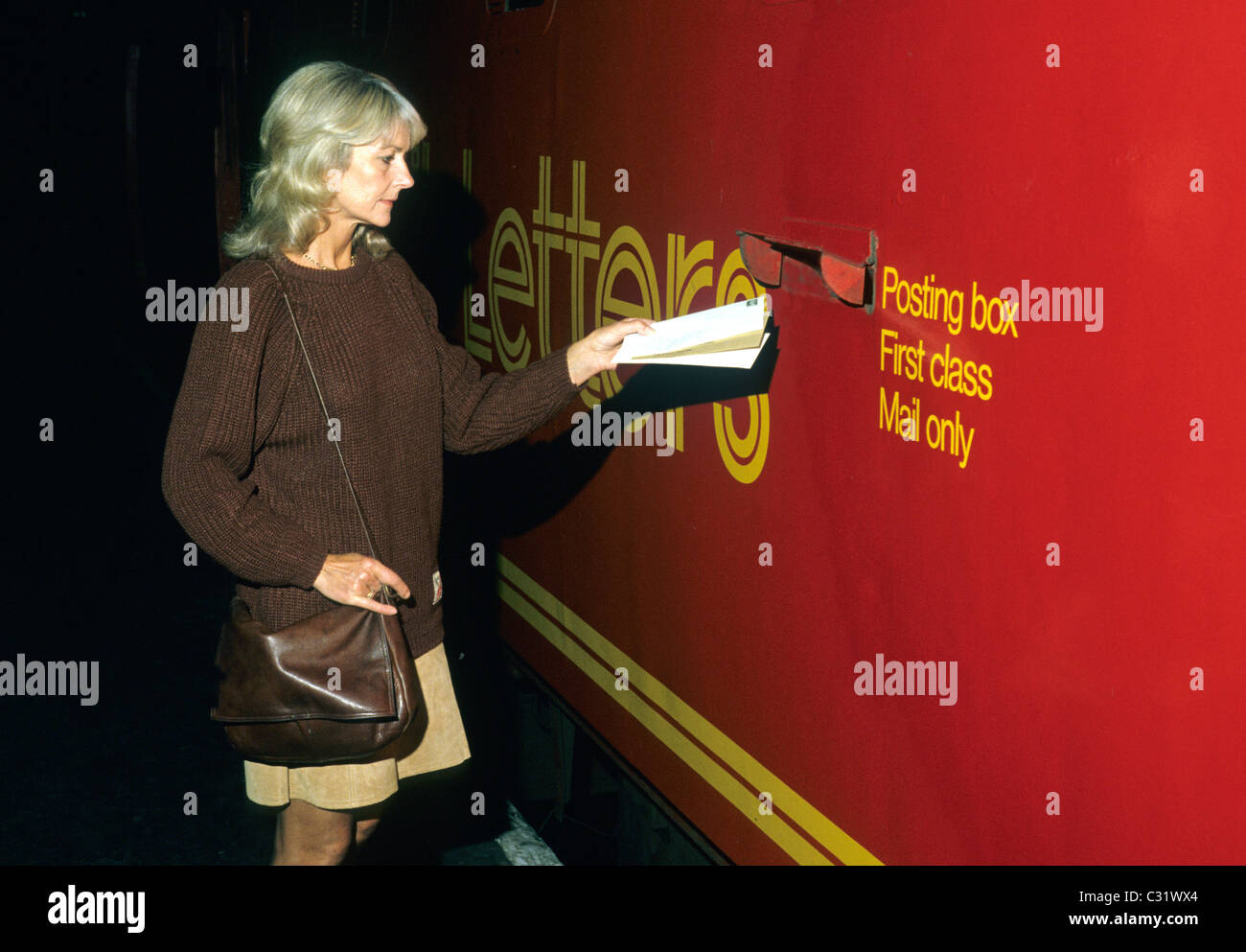 Paddington Station, Royal Mail Train coach TPO London, woman 