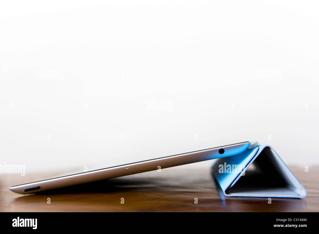An iPad 2 using the smart cover as a stand Stock Photo