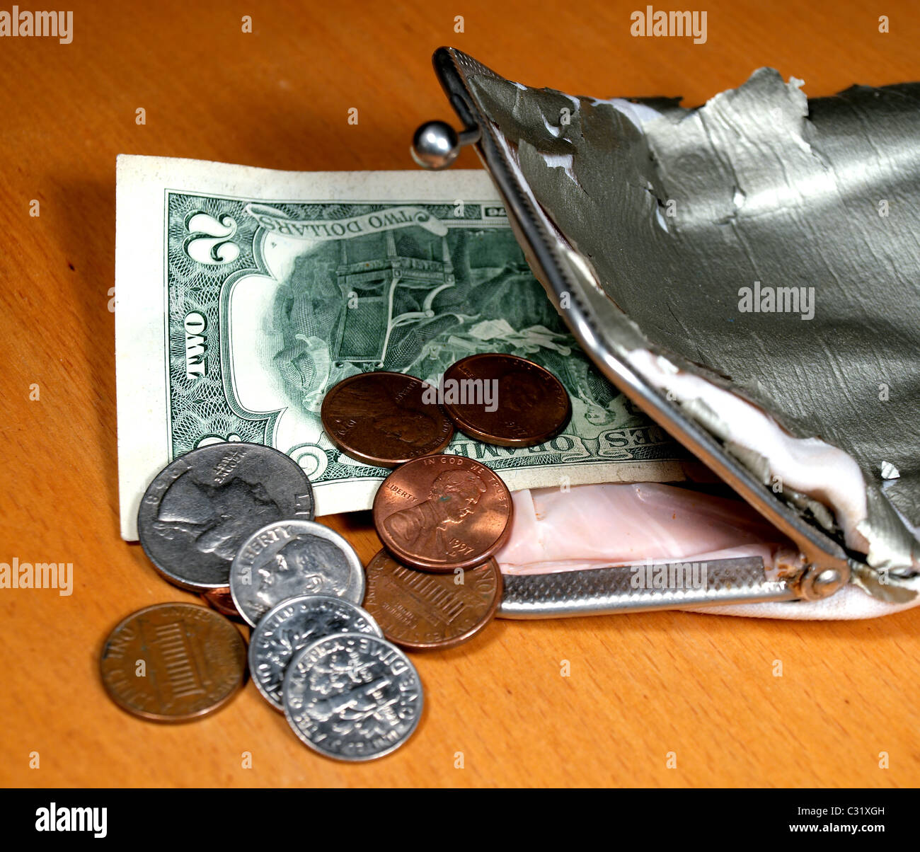 Old purse with several coins and a denomination Stock Photo