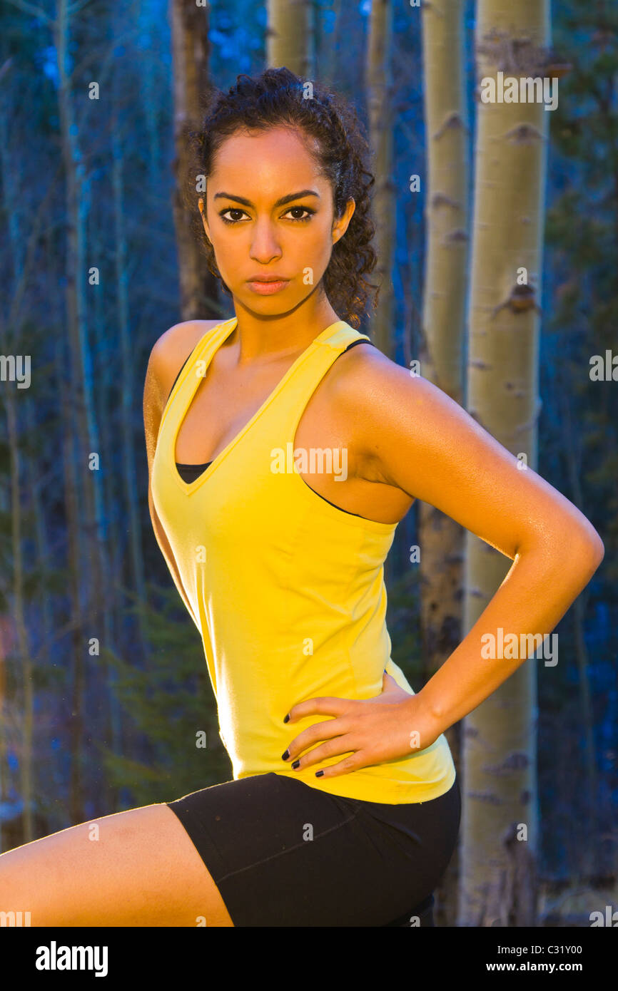 Mixed race runner standing in forest Stock Photo - Alamy