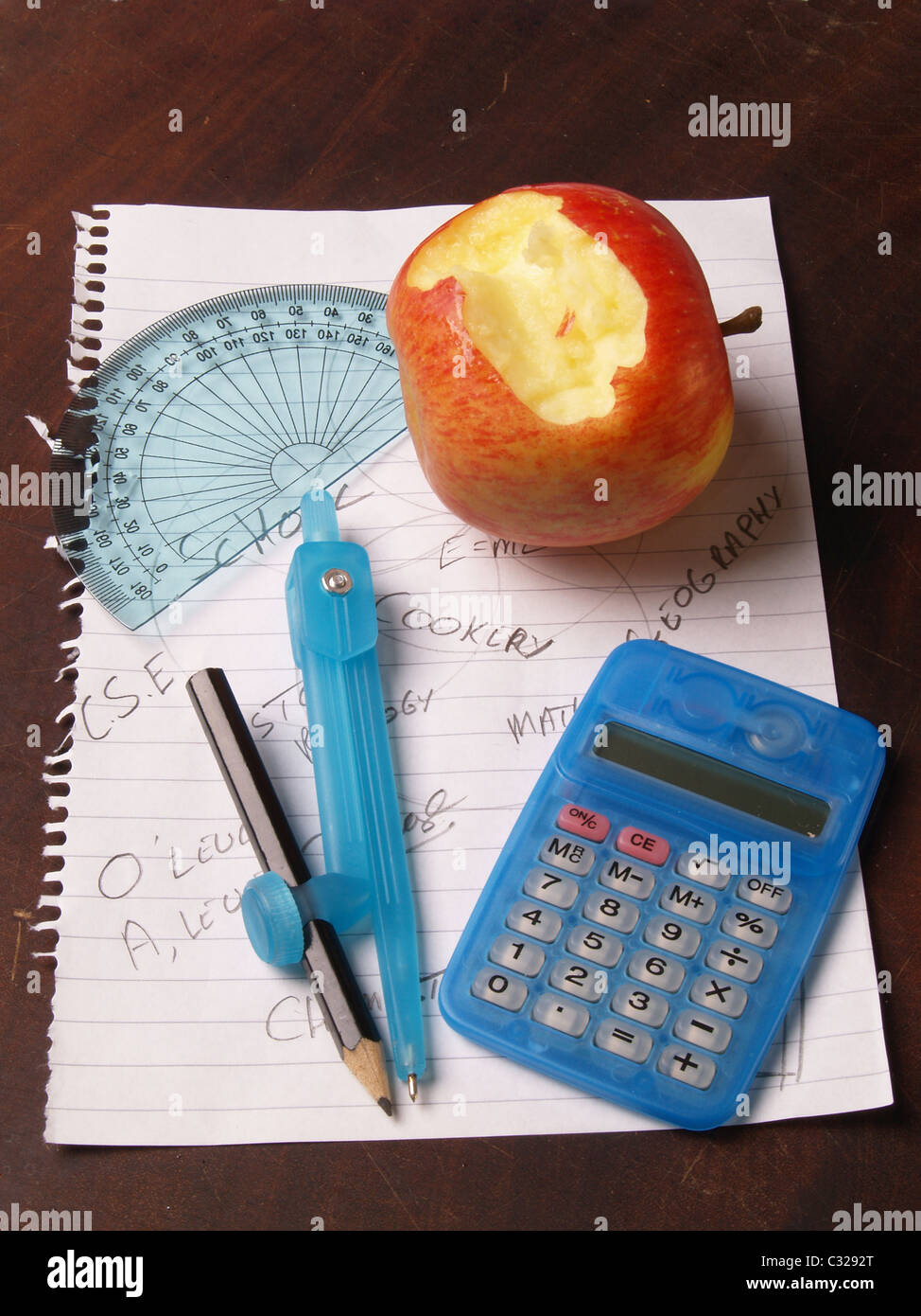 picture of protractor, calculator, apple as an education image Stock
