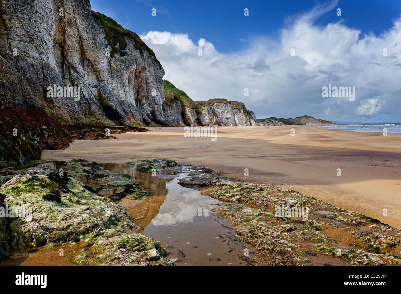 Rock pools and cliffs at the White Rocks in County Antrim. Stock Photo