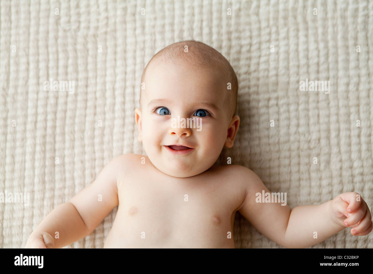 Baby boy lying on back Stock Photo Alamy