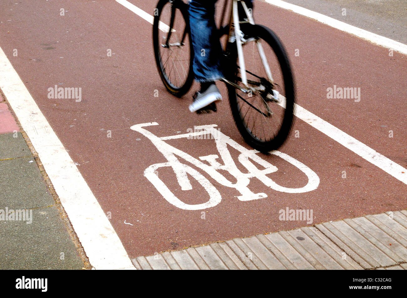 Cyclist using cycle lane Stock Photo Alamy