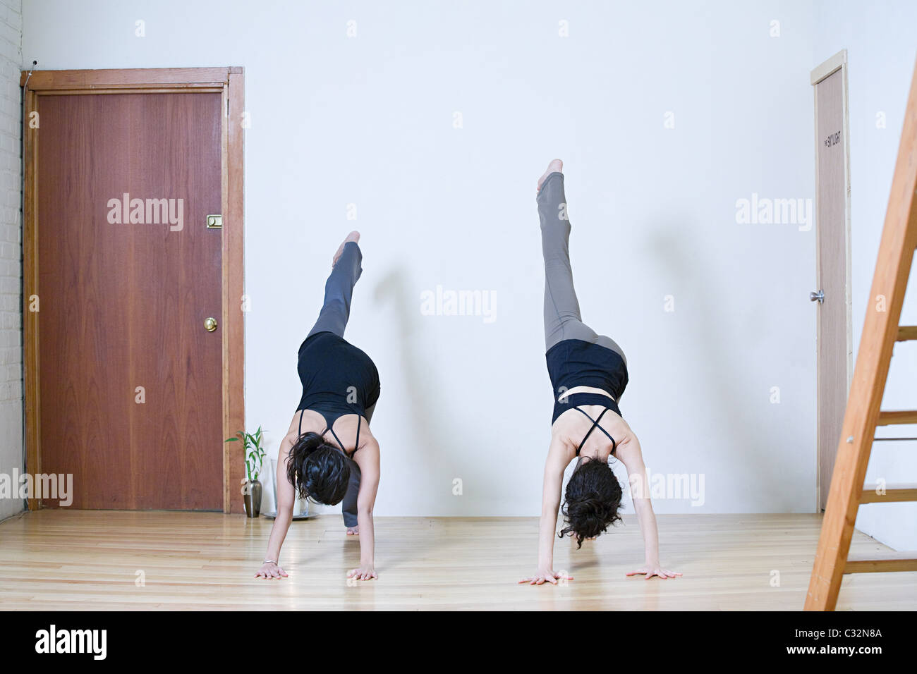 Women practicing yoga Stock Photo