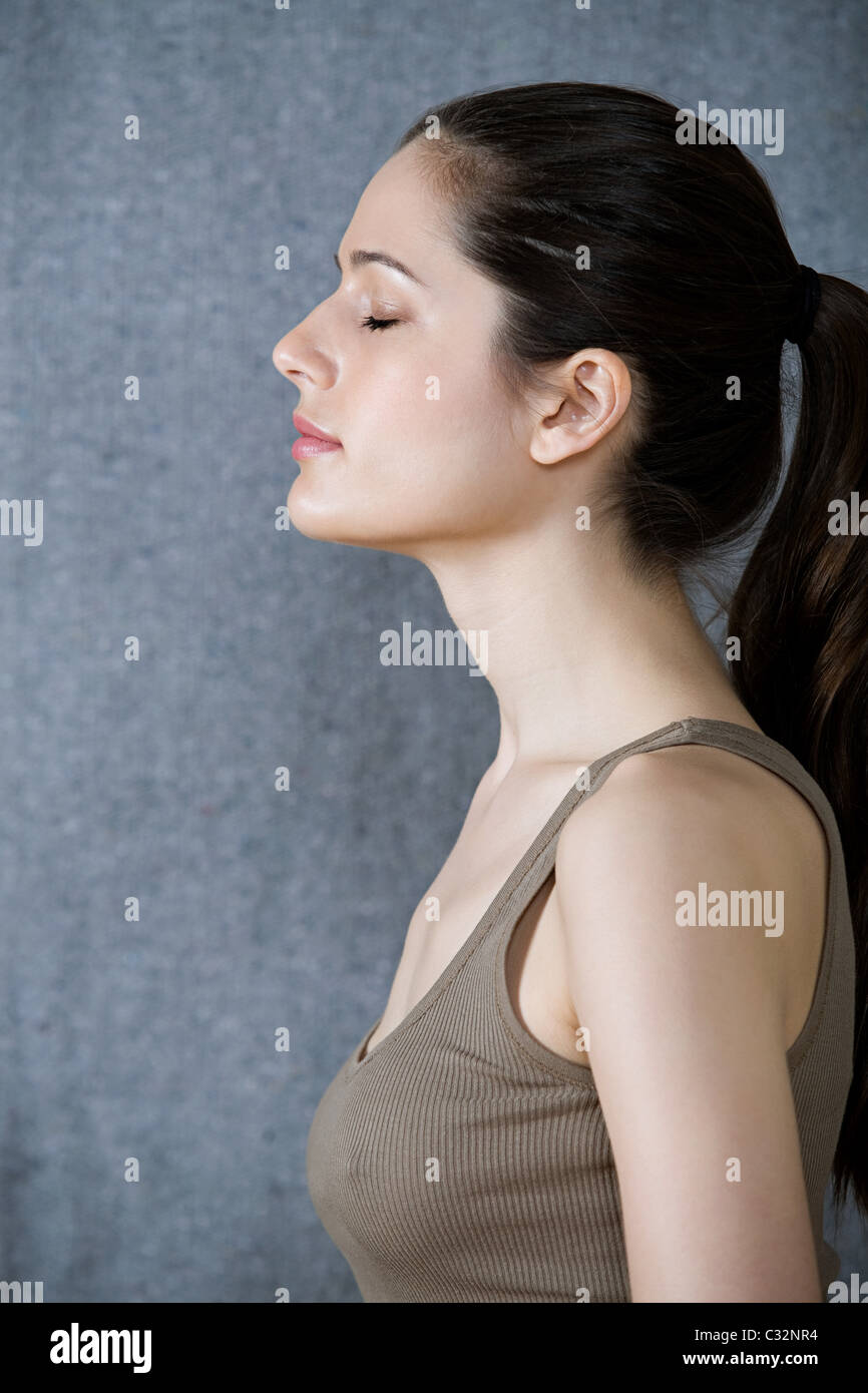 Serene woman with eyes closed Stock Photo