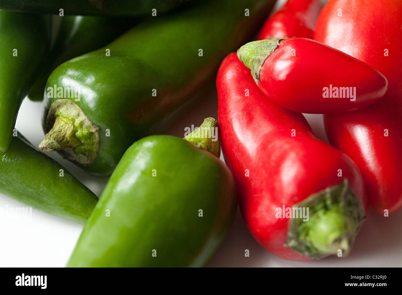 Green and red chilli peppers Stock Photo