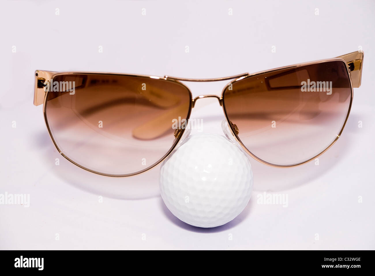 modern eyeglasses and ball at the white background Stock Photo