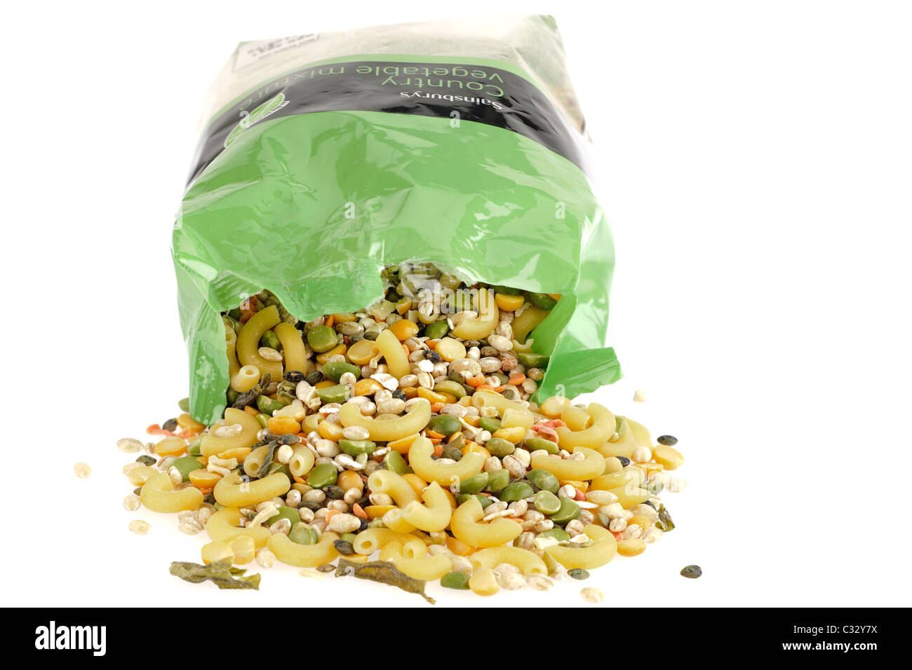 Bag of Sainsburys Country Vegetable Soup mixture spilling onto a white surface Stock Photo